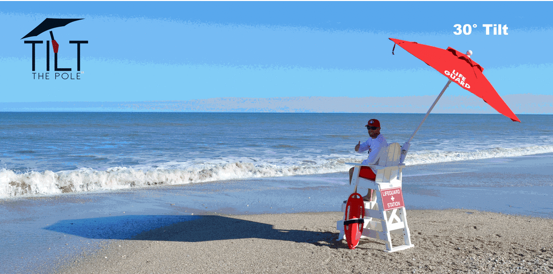 Lifeguard enjoying the shade from a tilted umbrella